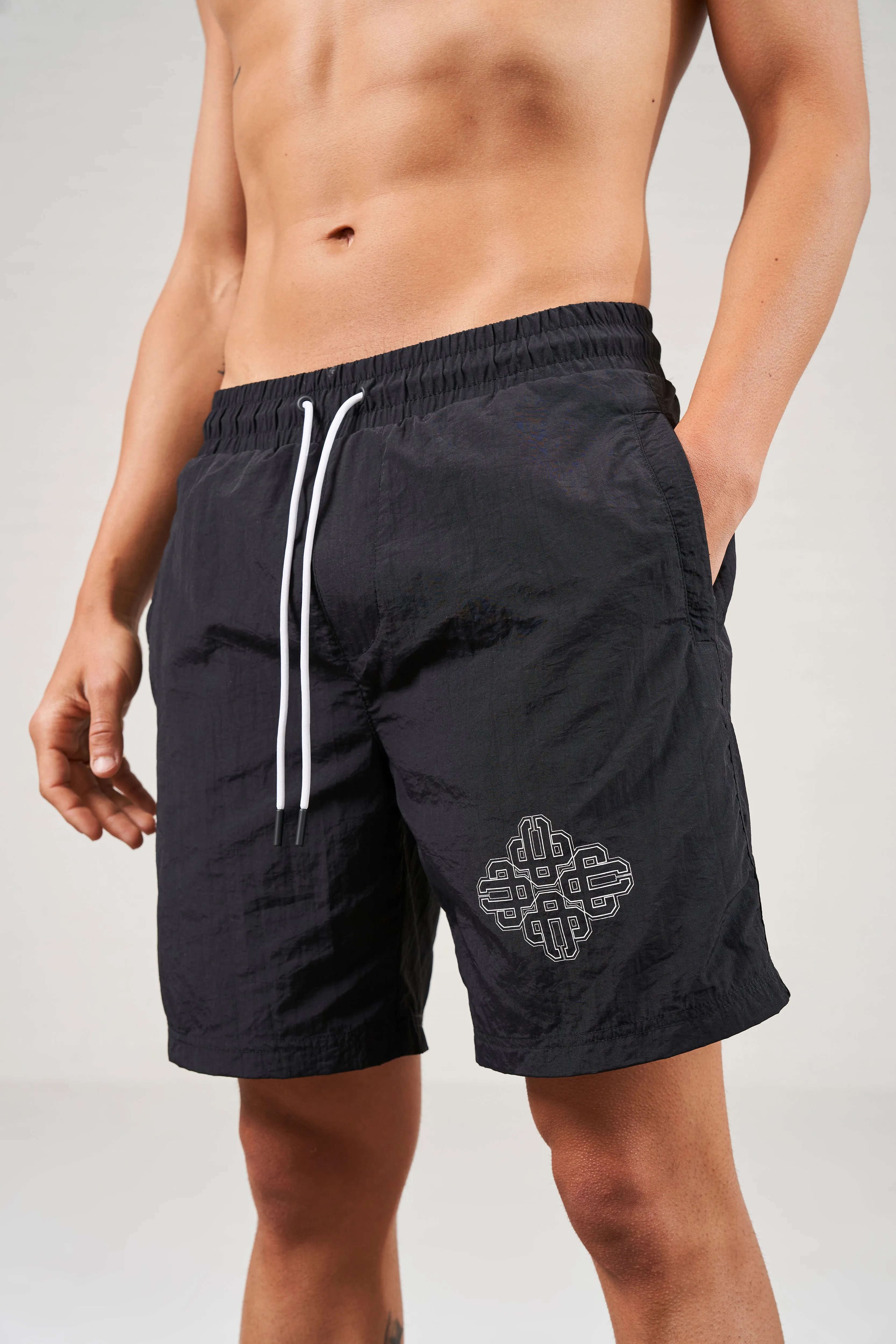COPYRIGHT EMBLEM MID LENGTH SWIM SHORTS - BLACK